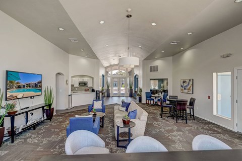 a living room with couches and chairs and a table